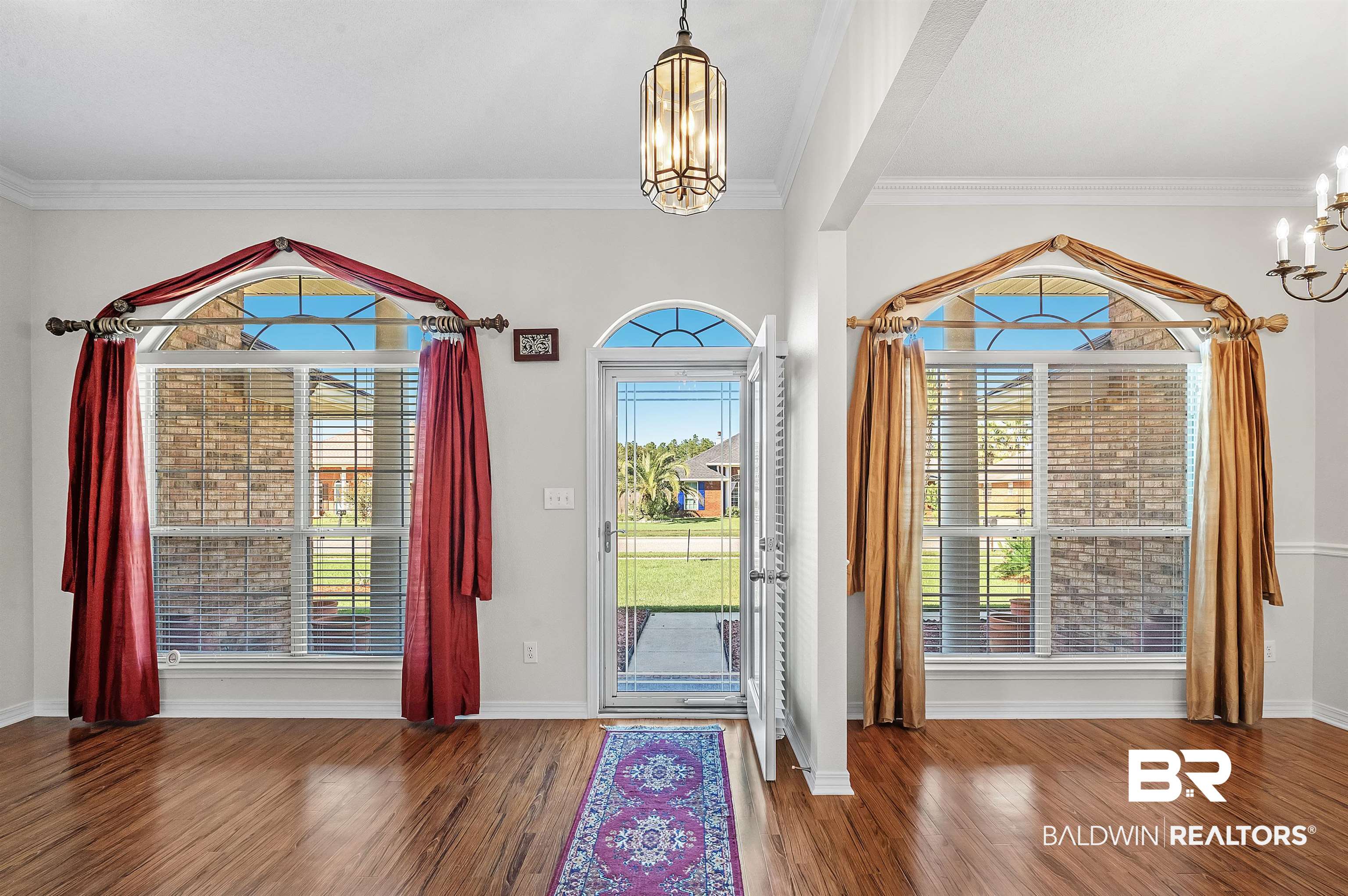 421 Collinwood Loop Foley, AL 36535 - Photo 25 of 62 Foyer featuring ornamental molding, hardwood / wood-style floors, and an inviting chandelier