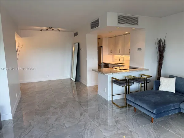 a living room with furniture and a table