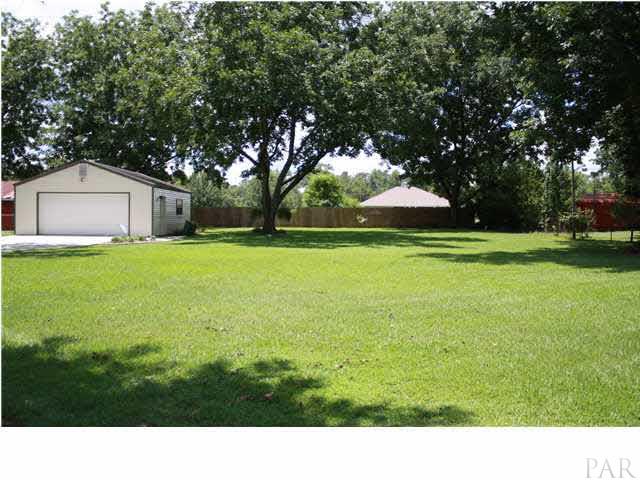 2387 Tuttle Road Cantonment, FL 32533 - Photo 23 of 25 A VIEW OF THE MANICURED BACK YARD AND WORKSHOP