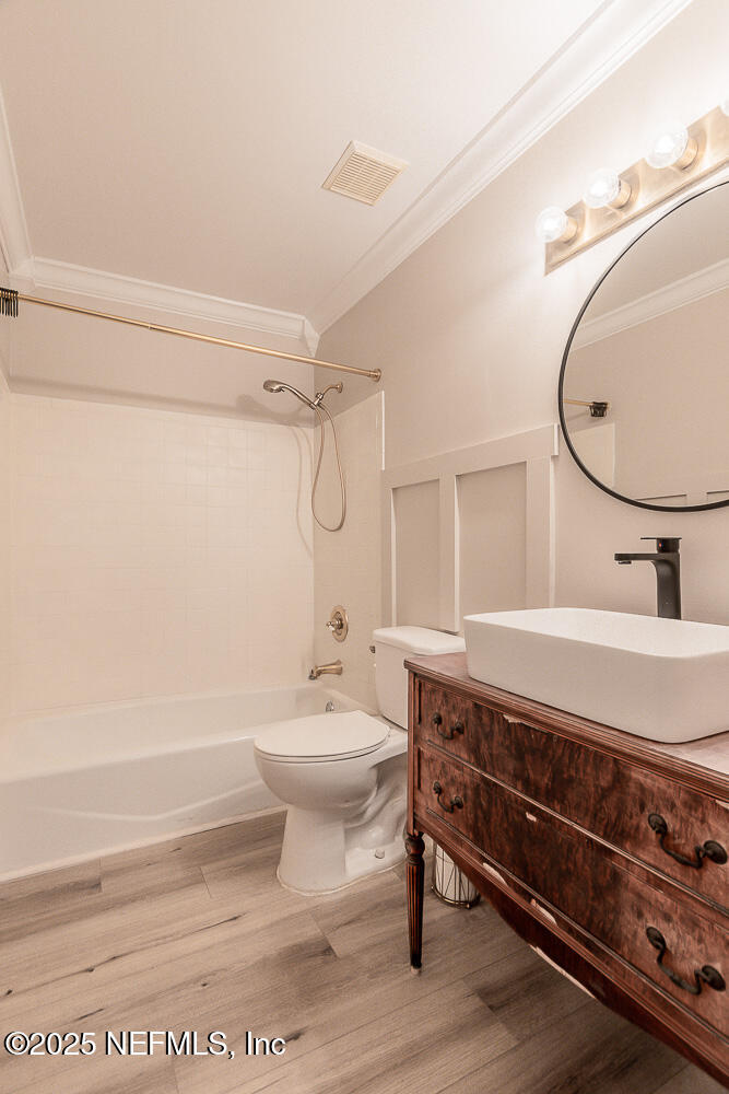 2168 Minorcan Street Middleburg, FL 32068 - Photo 15 of 24 a bathroom with a sink a toilet and shower