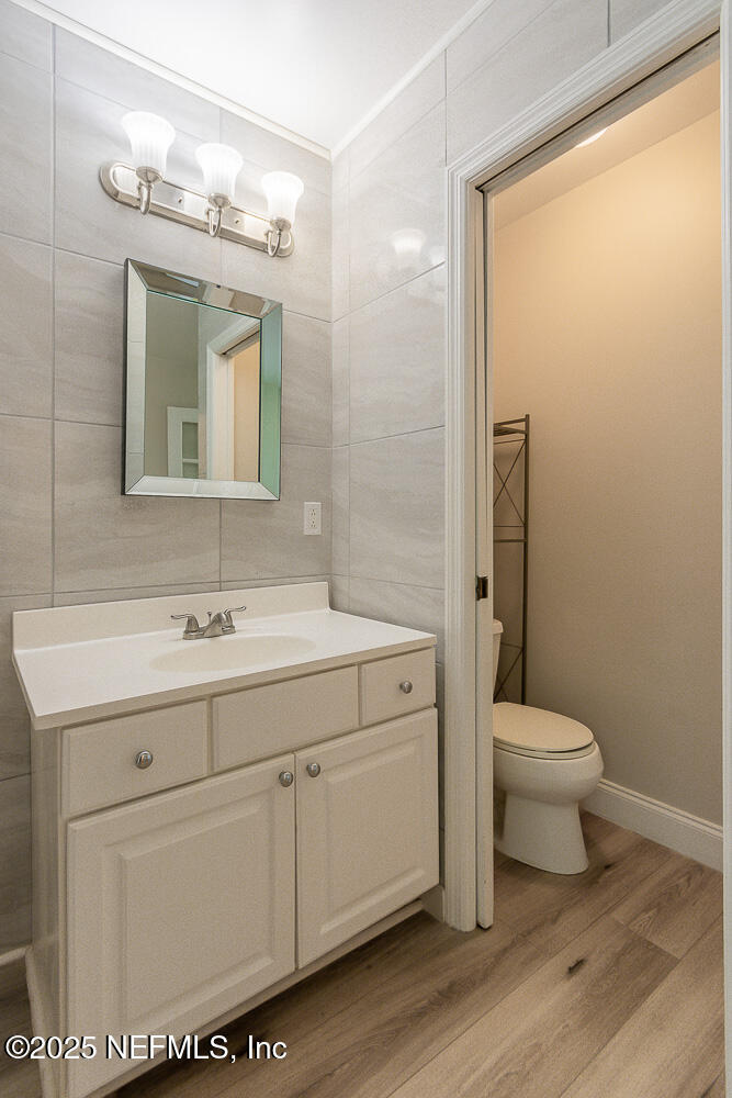 2168 Minorcan Street Middleburg, FL 32068 - Photo 20 of 24 a bathroom with a sink a toilet and shower