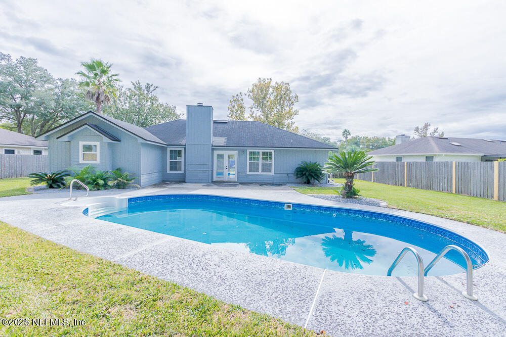 2168 Minorcan Street Middleburg, FL 32068 - Photo 22 of 24 a view of a house with swimming pool and a porch