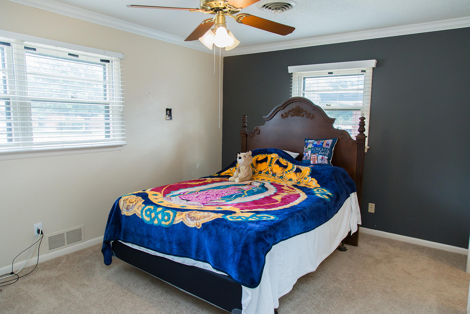 1107 Ennis Street Plainview, TX 79072 - Photo 30 of 42 a bed sitting in a bedroom next to a window