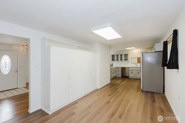 a wooden bench sitting in the middle of a yard