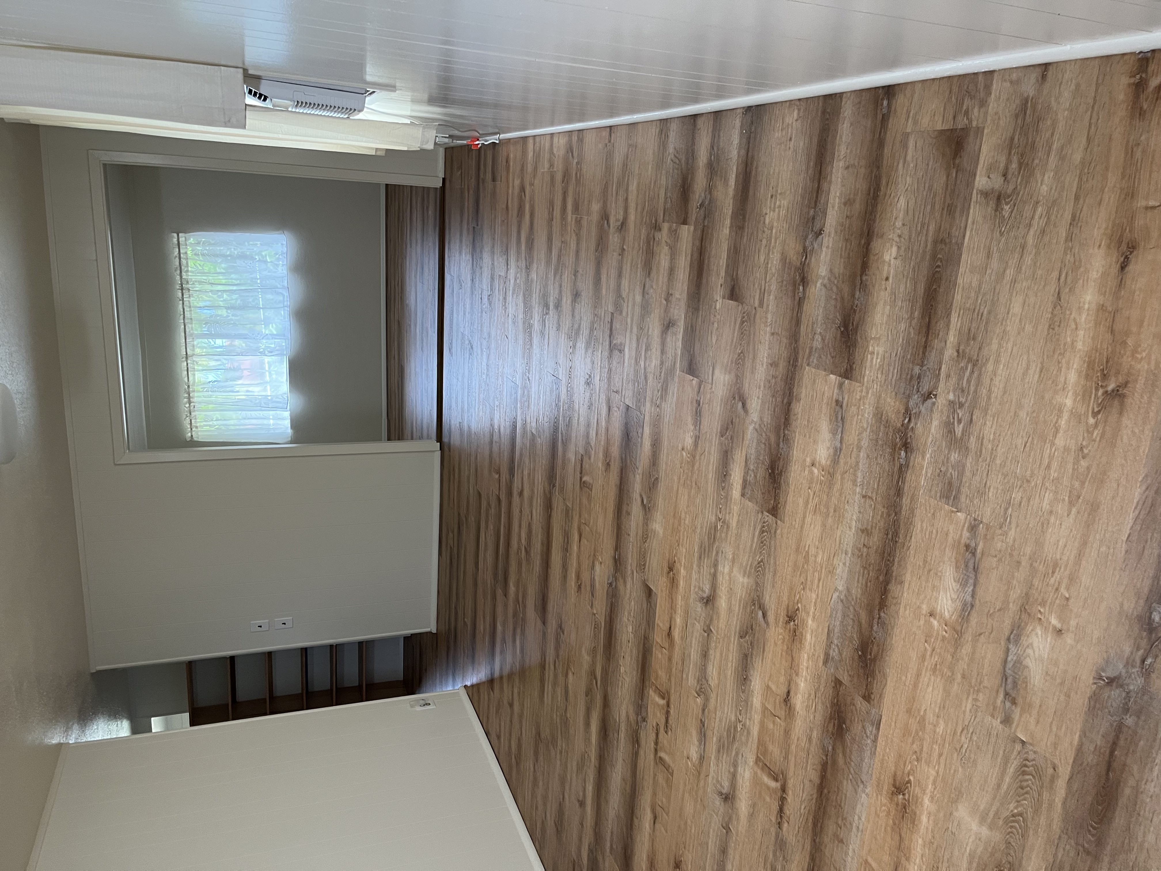 483 Hoopuni Way Hilo, HI 96720 - Photo 3 of 14 a view of wooden floor and windows in a room