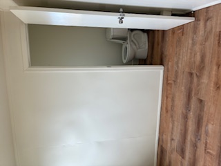 483 Hoopuni Way Hilo, HI 96720 - Photo 6 of 14 a view of a room with wooden floor and bathroom