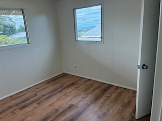 483 Hoopuni Way Hilo, HI 96720 - Photo 7 of 14 an empty room with a window