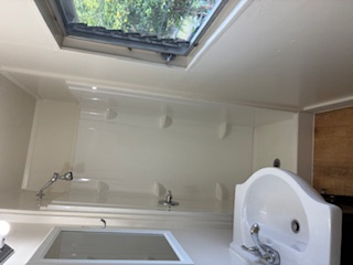 483 Hoopuni Way Hilo, HI 96720 - Photo 9 of 14 a bathroom with a sink and shower