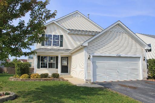 1319 Roth Drive Joliet, IL 60431 - Photo 1 of 10 a front view of a house with a yard