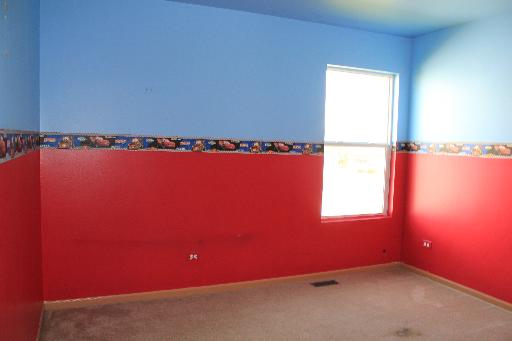 1319 Roth Drive Joliet, IL 60431 - Photo 7 of 10 an empty room and window