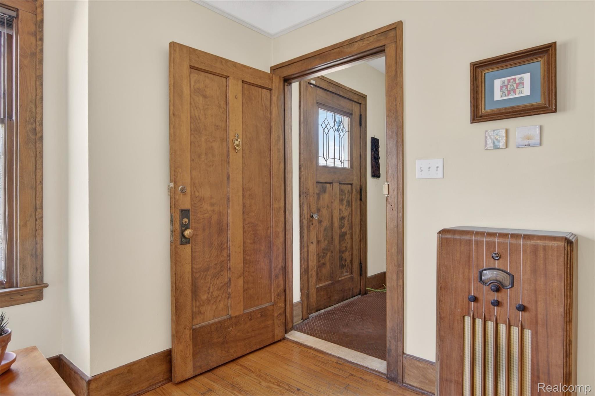 925 Nottingham Road Grosse Pointe, MI 48230 - Photo 35 of 46 Foyer entrance with light wood finished floors and baseboards