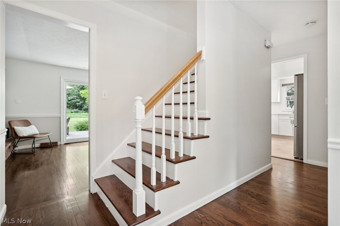 139 Solon Road Chagrin Falls, OH 44022 - Photo 6 of 41 Stairs with dark hardwood / wood-style floors