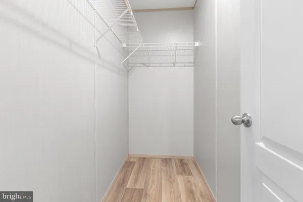 a view of a room with racks on the wall