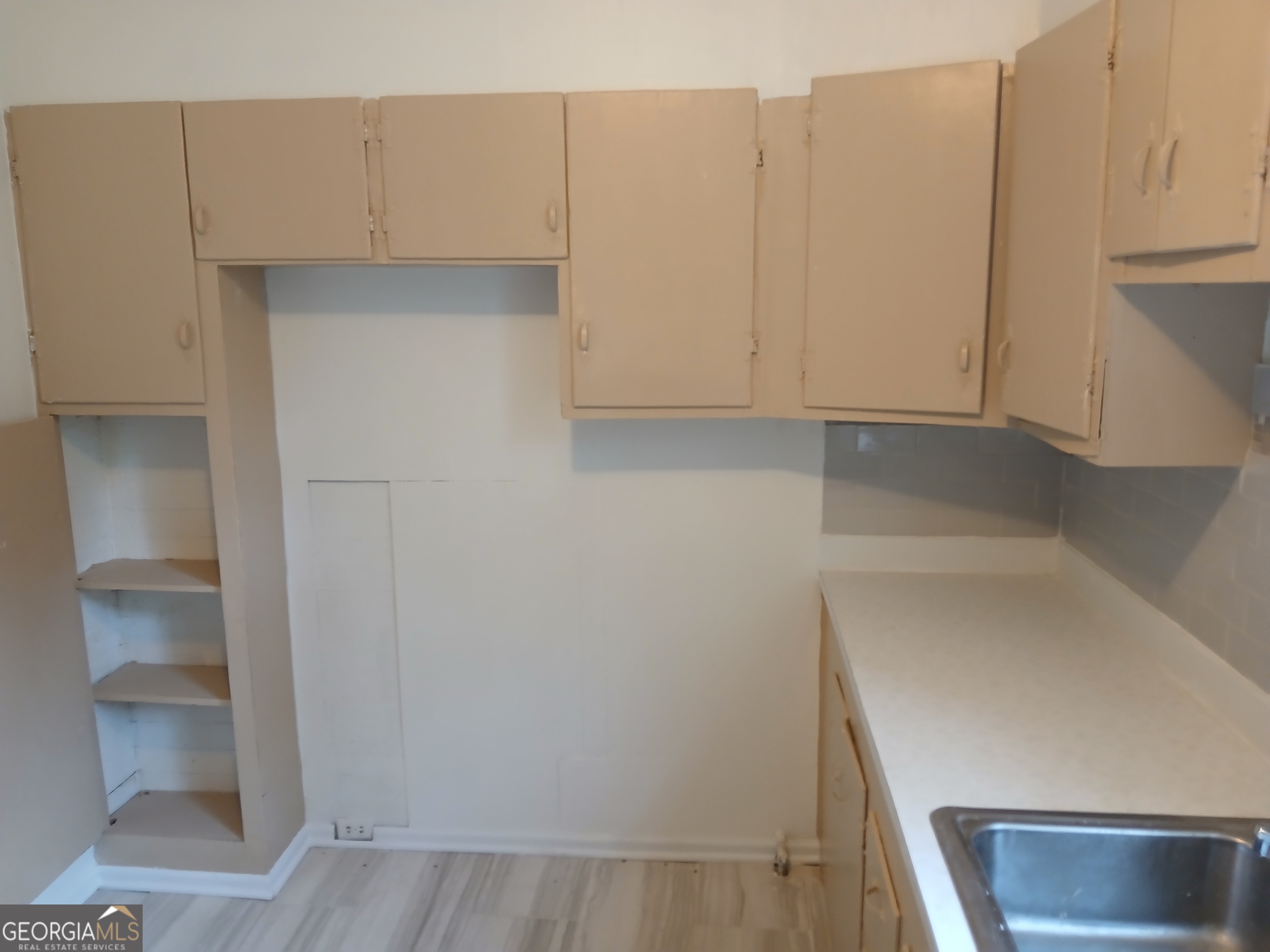 678 Dixie Avenue Macon, GA 31206 - Photo 13 of 19 a view of cabinets and utility room with closet