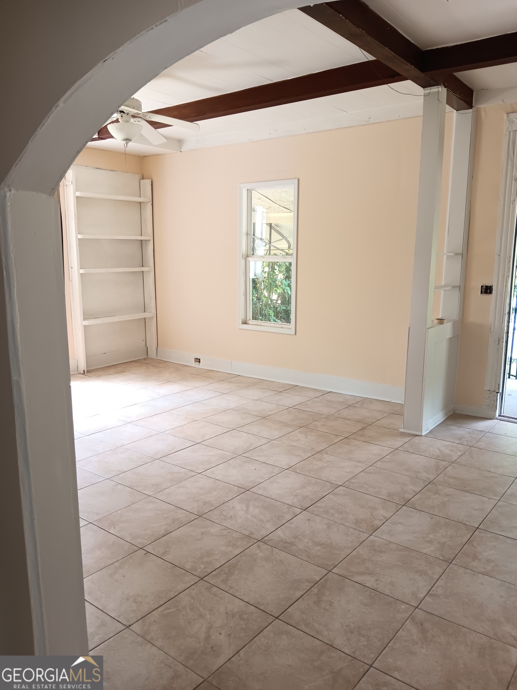 678 Dixie Avenue Macon, GA 31206 - Photo 5 of 19 a view of an empty room with a window