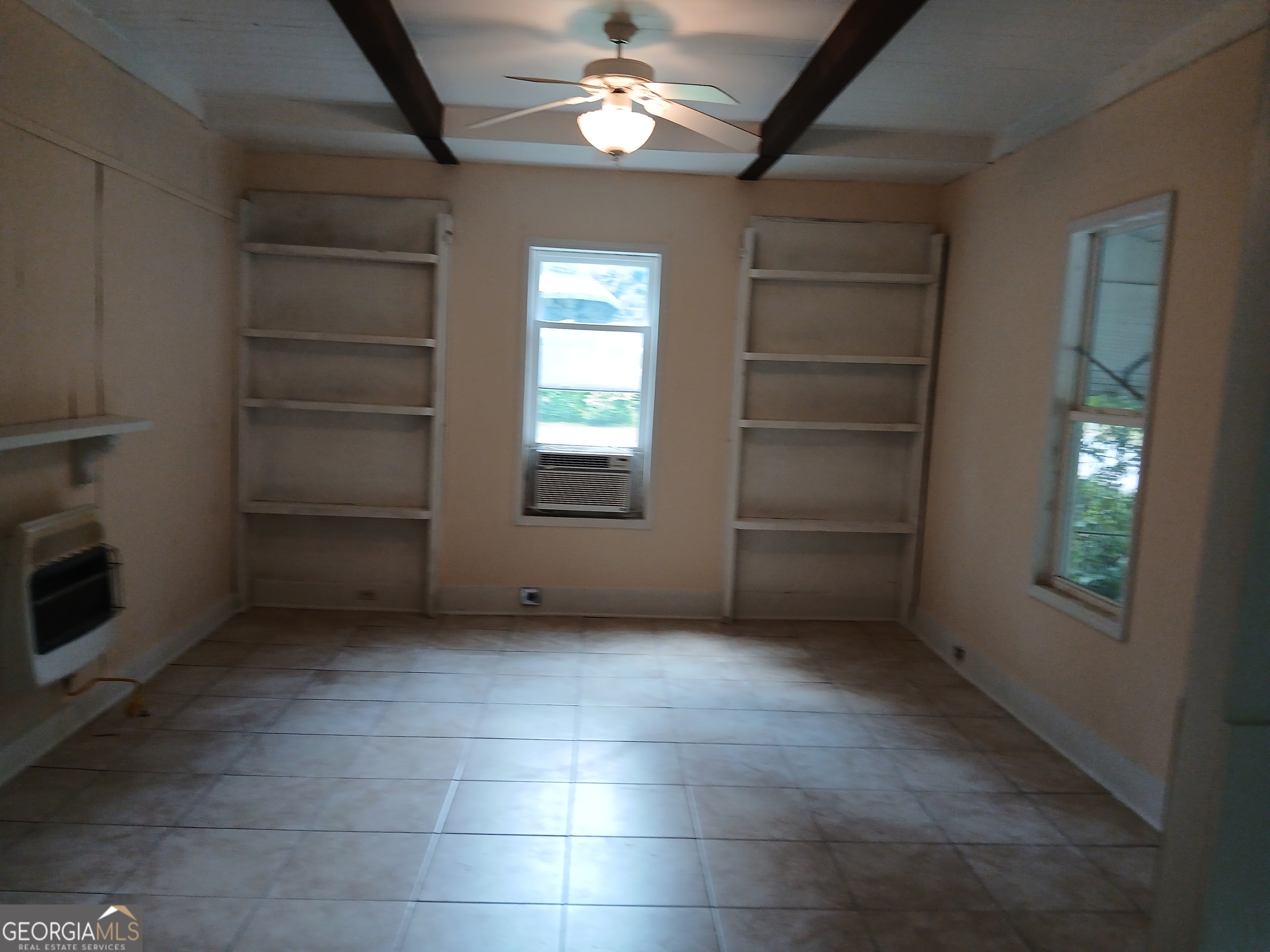 678 Dixie Avenue Macon, GA 31206 - Photo 6 of 19 a view of an empty room with a window