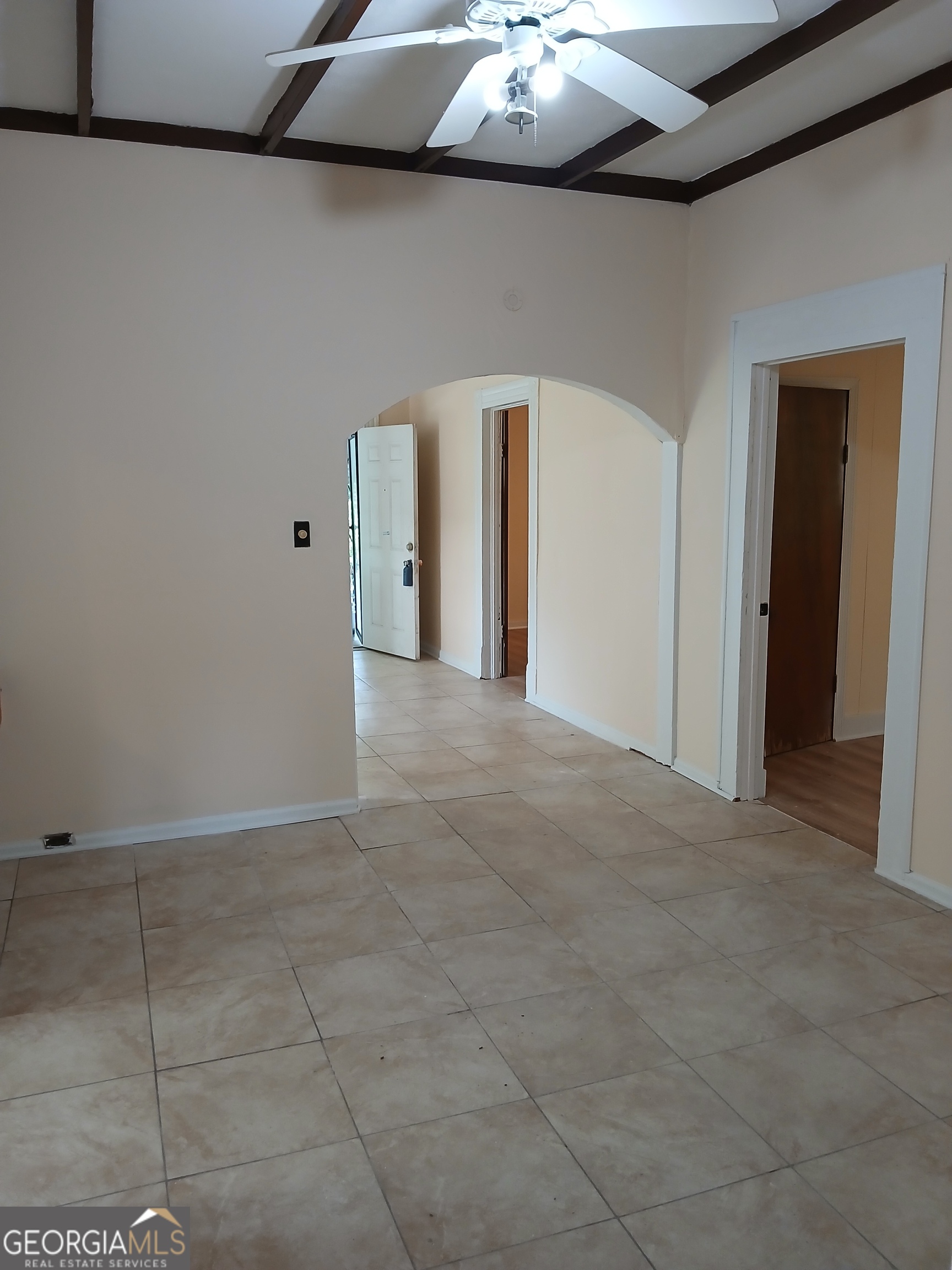 678 Dixie Avenue Macon, GA 31206 - Photo 8 of 19 a view of an empty room with a chandelier fan
