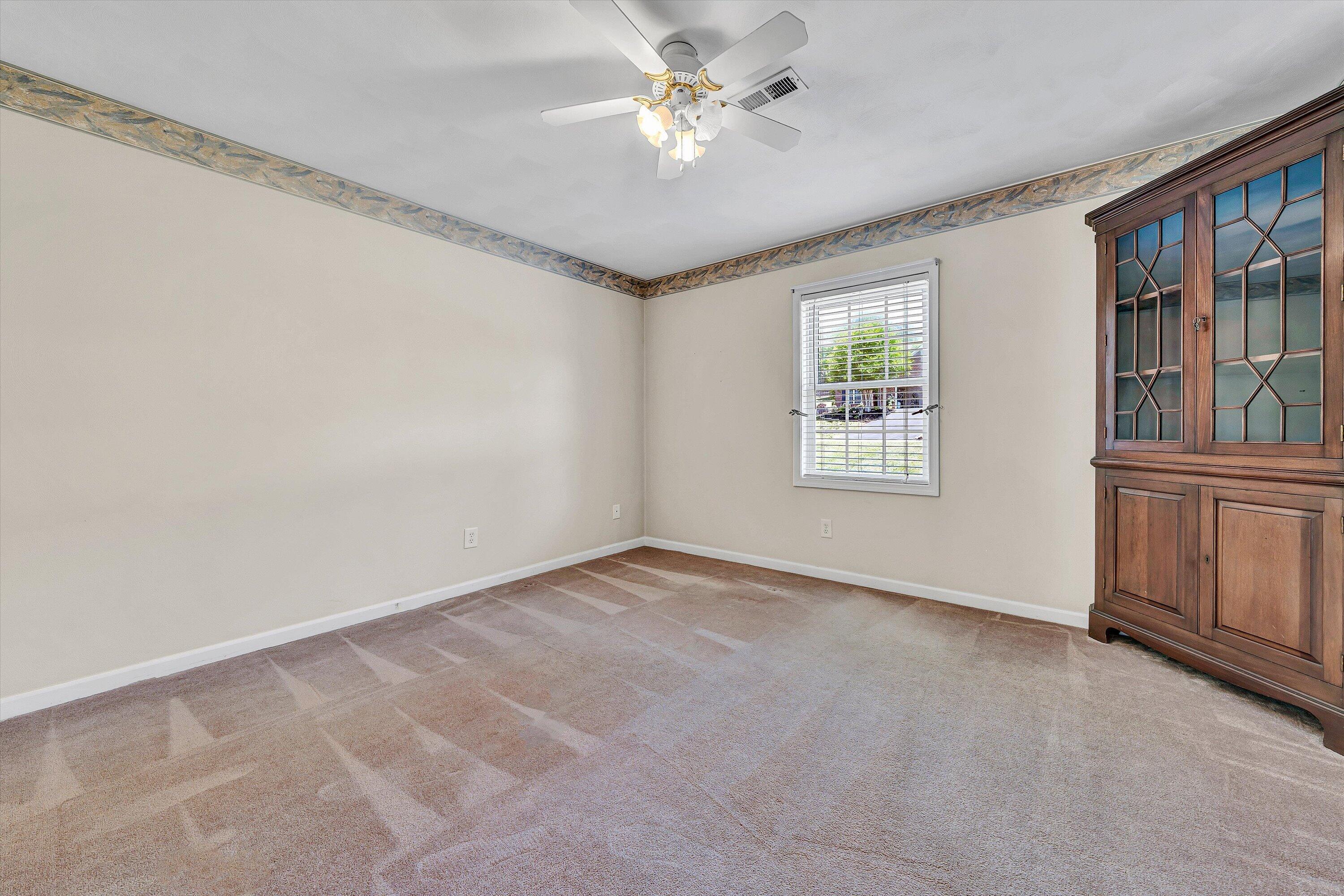 3516 Pinnacle Ridge Road Northeast Roanoke, VA 24012 - Photo 26 of 39 an empty room with windows and ceiling fan