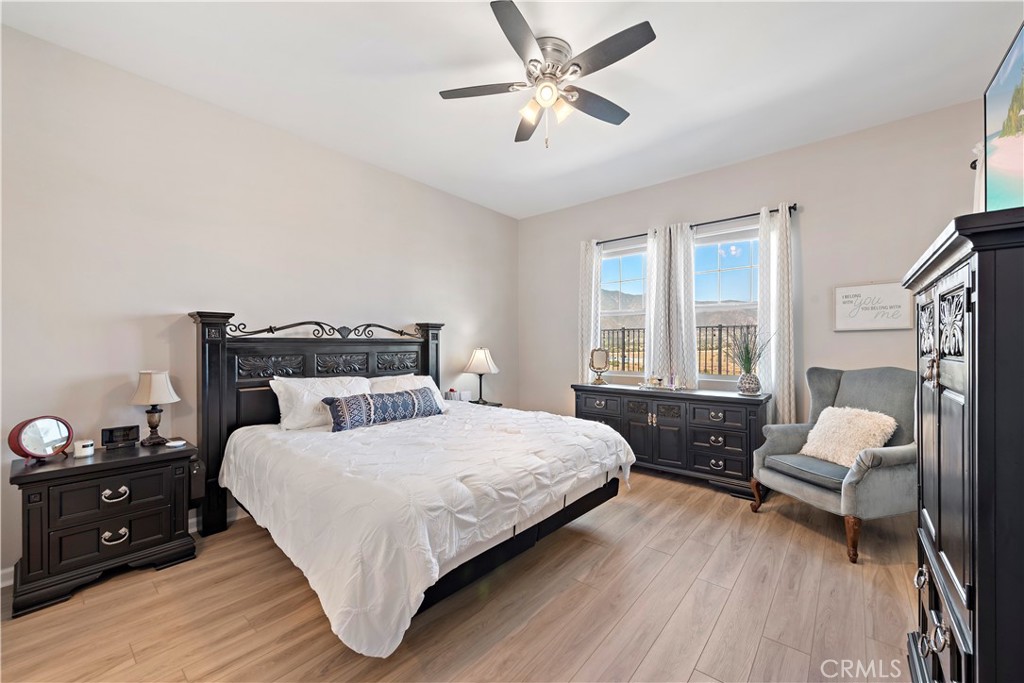 24301 Overlook Drive Corona, CA 92883 - Photo 11 of 20 a bedroom with a bed and wooden floor