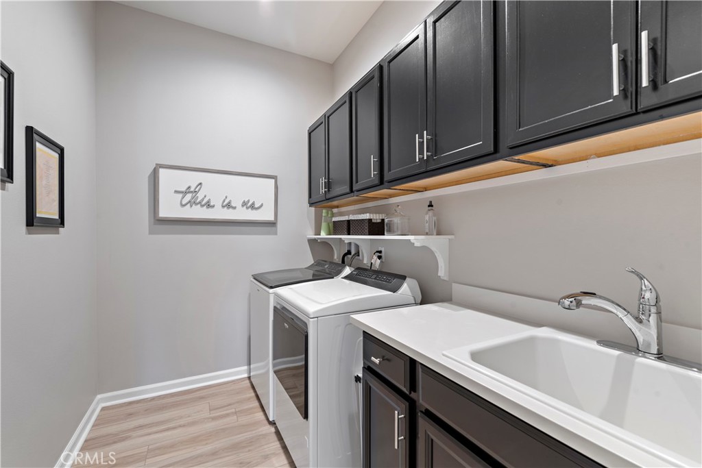 24301 Overlook Drive Corona, CA 92883 - Photo 14 of 20 a utility room with dryer and washer