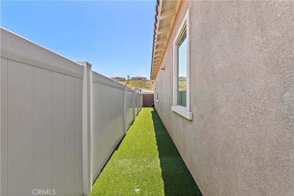 24301 Overlook Drive Corona, CA 92883 - Photo 15 of 20 a view of a brick house with a small yard