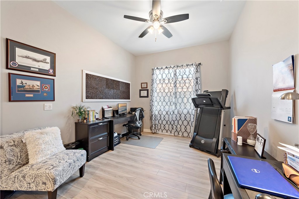 24301 Overlook Drive Corona, CA 92883 - Photo 5 of 20 a living room with furniture a flat screen tv and a window
