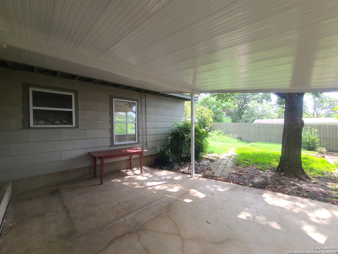 106 Ridgehaven Place San Antonio, TX 78209 - Photo 20 of 22 a view of a porch with chairs and backyard