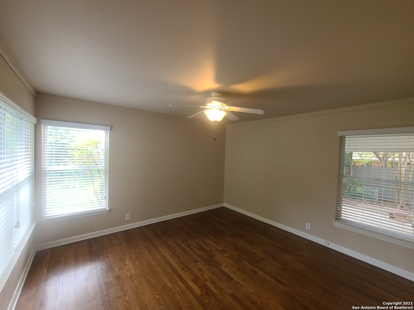 106 Ridgehaven Place San Antonio, TX 78209 - Photo 7 of 22 an empty room with wooden floor and windows