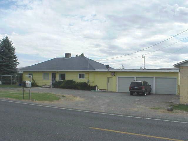 6606 Mieras Road Yakima, WA 98901 - Photo 1 of 2 a front view of a house with a yard