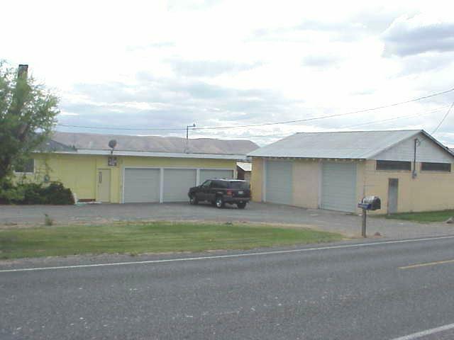 6606 Mieras Road Yakima, WA 98901 - Photo 2 of 2 a view of a house with a yard and garage