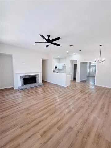 a view of a room with kitchen and fireplace