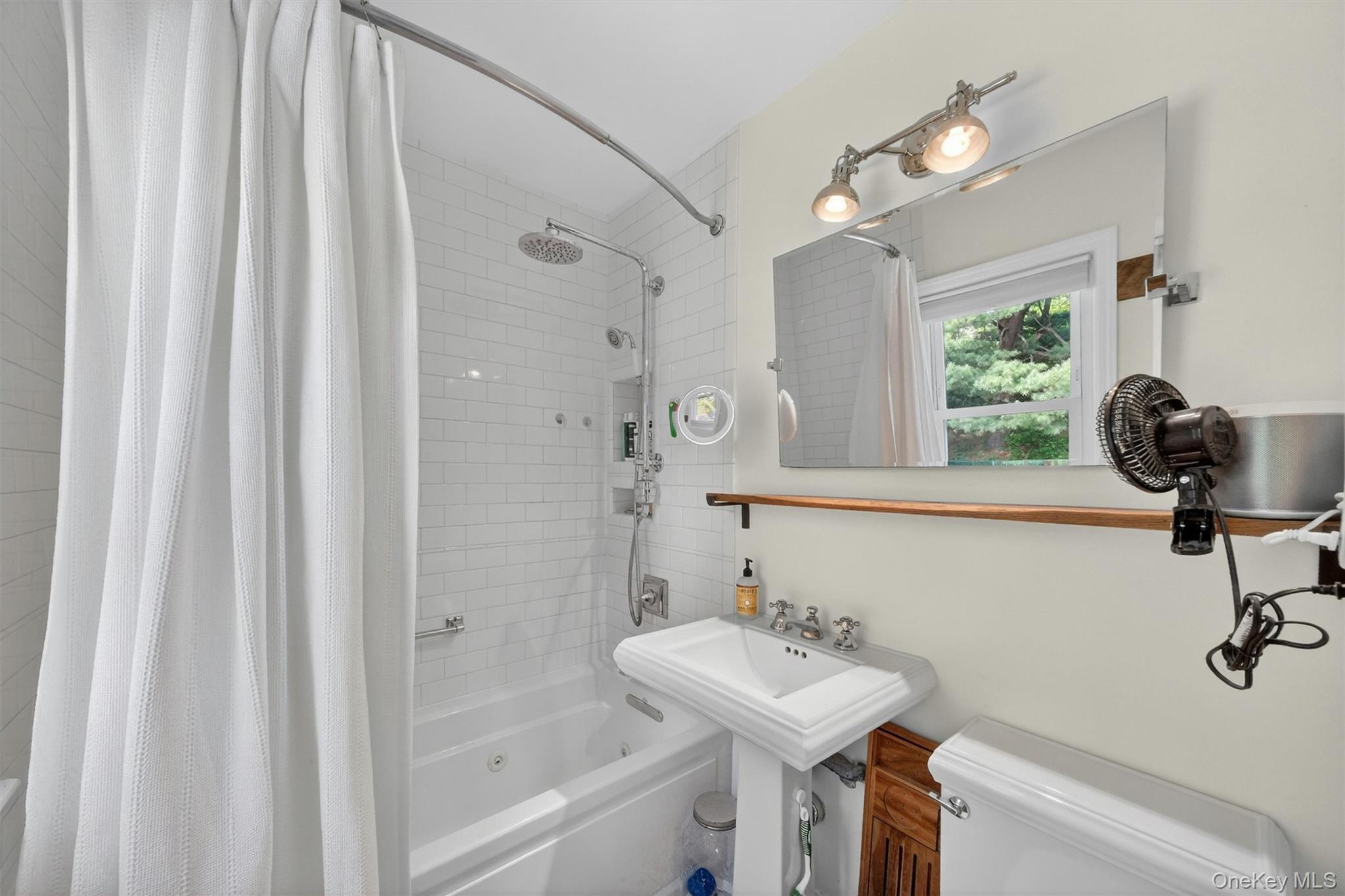 10 Edwin Road Poughkeepsie, NY 12603 - Photo 22 of 46 a bathroom with a sink a toilet and shower