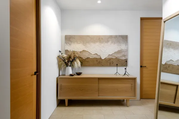 a bed room with a bed and a large window