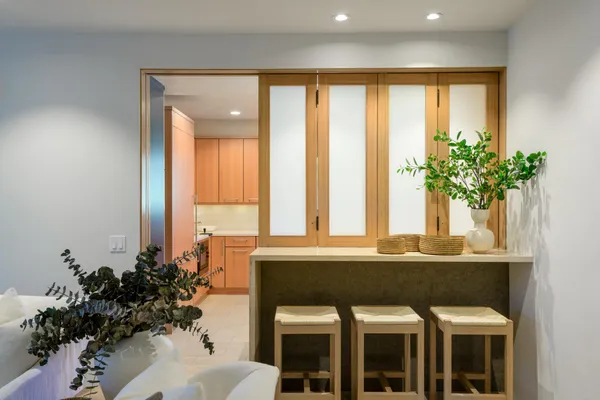 a dining room with a table and chairs