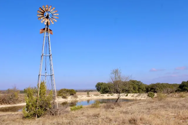 a view of a street with a building in the background