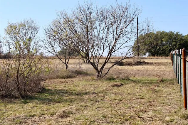 a view of a yard covered with snow