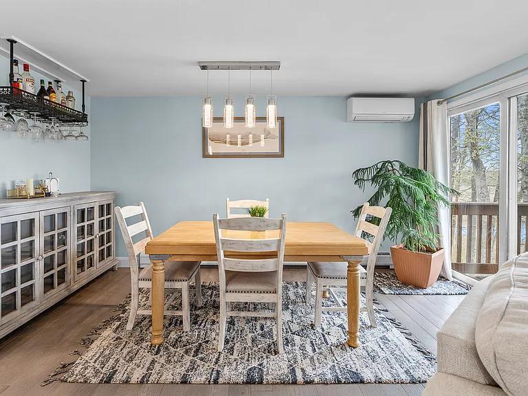 15 Riverview Avenue, Unit D Mashpee, MA 02649 - Photo 4 of 33 a dining room with furniture and wooden floor