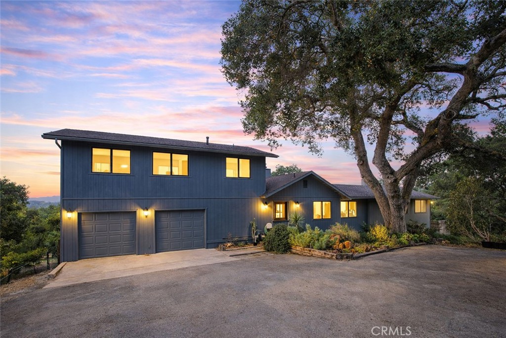 a front view of a house with yard