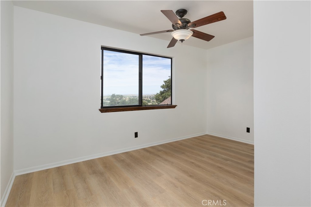 3175 Arena Avenue Atascadero, CA 93422 - Photo 17 of 40 an empty room with a window and a fan