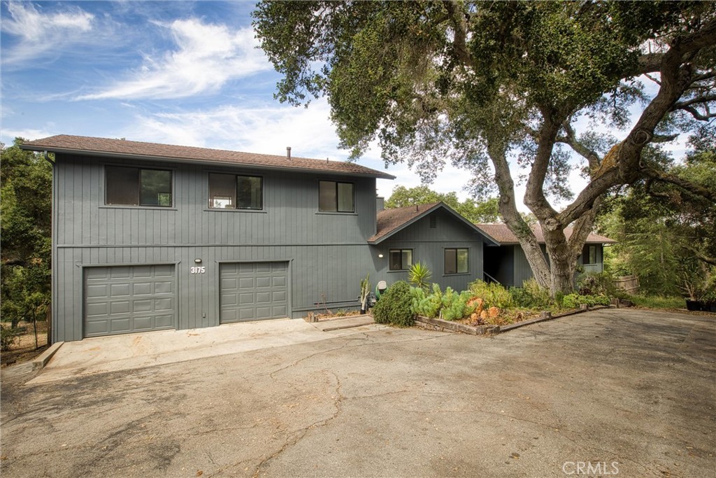 3175 Arena Avenue Atascadero, CA 93422 - Photo 2 of 40 a front view of a house with a yard and garage