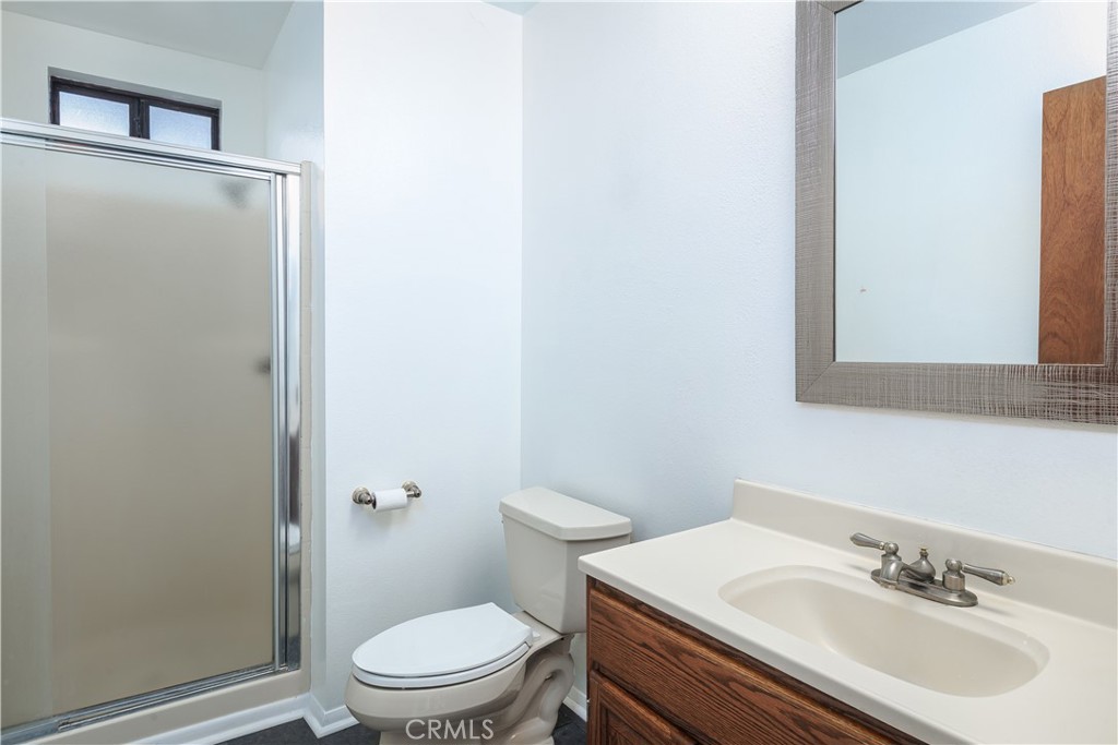 3175 Arena Avenue Atascadero, CA 93422 - Photo 24 of 40 a bathroom with a sink a toilet and shower