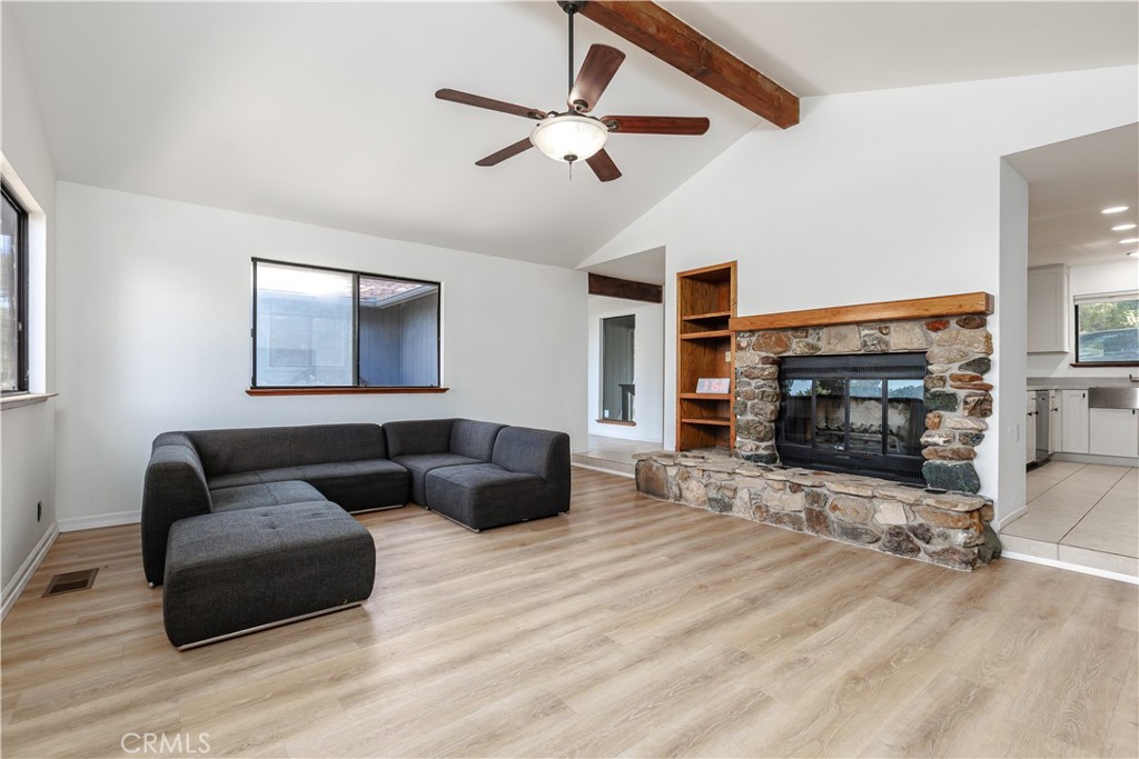 3175 Arena Avenue Atascadero, CA 93422 - Photo 7 of 40 a living room with furniture and a fireplace