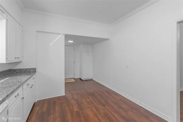 a view of hallway with wooden floor