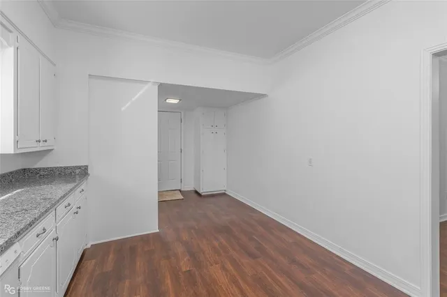 a view of hallway with wooden floor