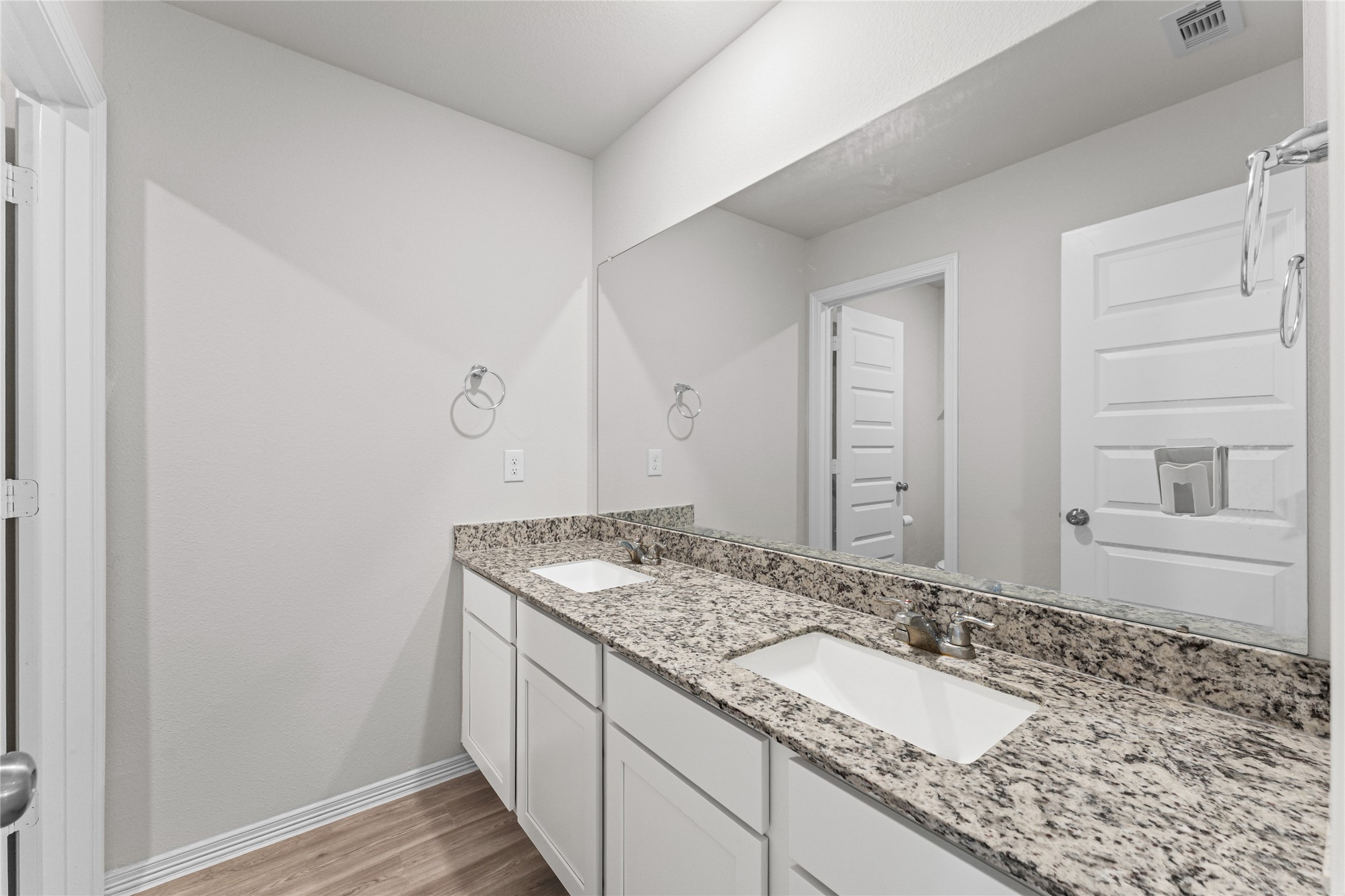 23326 Spring Genesis Lane Katy, TX 77493 - Photo 15 of 32 a bathroom with a granite countertop sink and a mirror