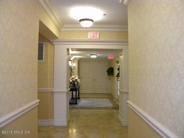 2 Dearfield Drive, Unit 2B Greenwich, CT 06831 - Photo 11 of 13 a view of a hallway with wooden floor and a living room