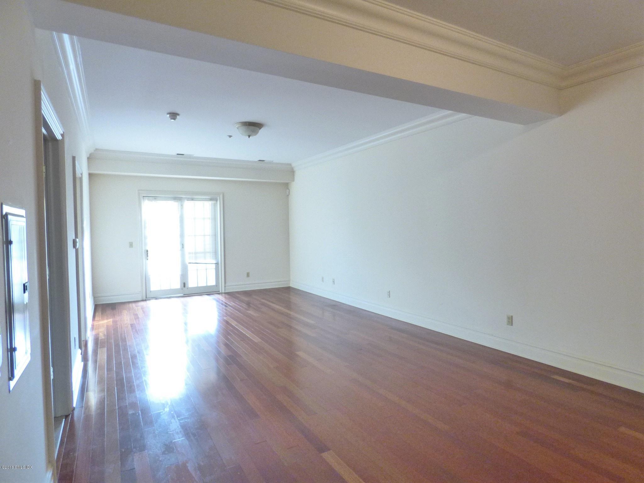 2 Dearfield Drive, Unit 2B Greenwich, CT 06831 - Photo 8 of 13 a view of an empty room and wooden floor