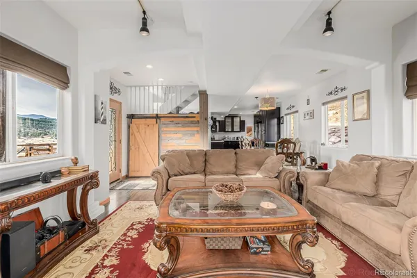 a living room with furniture and a table