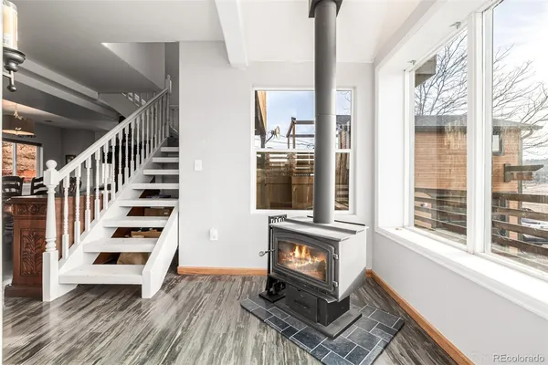 a view of entryway with stairs and wooden floor