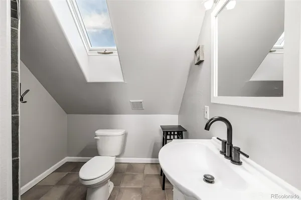 a bathroom with a shower and a sink